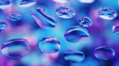 Mor, mavi, turkuaz ve pembe tonlarda soyut bir arkaplan. Camın üzerindeki damlalarda renklerin tonları değişiyor.