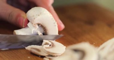 cut thin slices of champignon with a knife. cook.