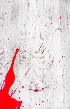 abstract bloody scarlet stain on textured surface. Under the gun of a terrorist attack