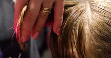 hairdresser cuts multi-colored bangs Barbershop salon