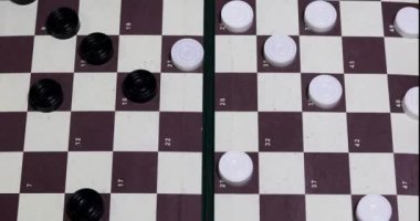 play International Drafts student with coach, top view.