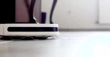 robot vacuum cleaner cleans the room at speed, horizontal