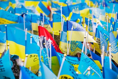 flags of Ukraine with a trident as a symbol of those who died in the war between Ukraine and Russia. horizontal