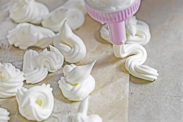 stock image meringue on the tip of a pastry syringe. Cook classic meringue.