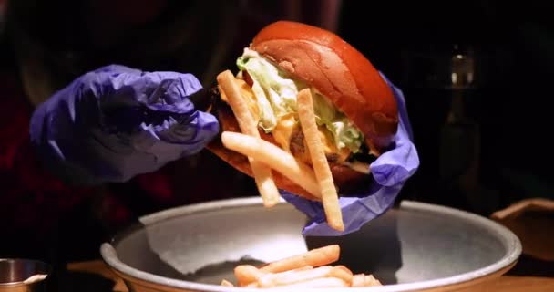 Little Girl Pleasure Disposable Gloves Bites Huge Burger Horizontal — Stock Video