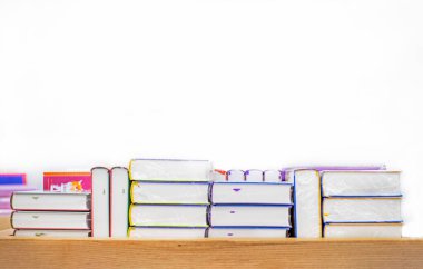 thick books textbooks stacked on a wooden table. Education. back to school clipart