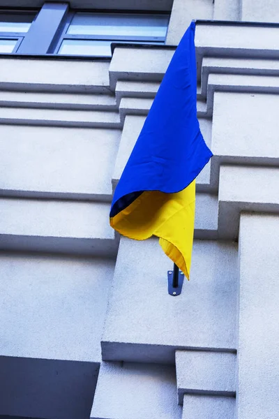 Ukrainian flag on an architectural building. Support and War in Ukraine