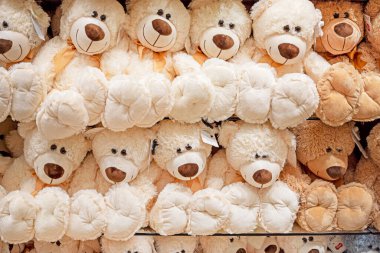 soft toy white and brown teddy bears on the counter in a children's store clipart