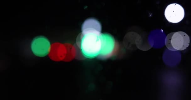 Blurred Multi Colored Lanterns Headlights Cars Windshield Dark — Stock Video