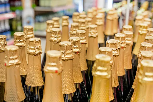 packs of sparkling white and red wine in a supermarket. preparation for the holiday