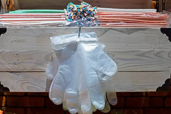 stock image chewing candies and disposable gloves for self-service in the supermarket