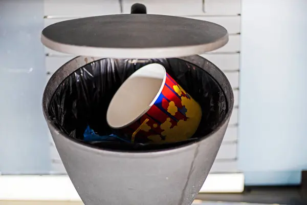 stock image trash container with garbage in the interior of the cinema hall