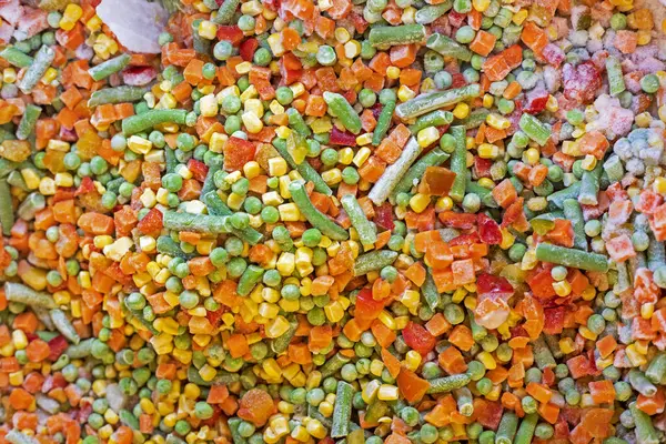 stock image background of frozen vegetables cut into pieces. Vegan nutrition