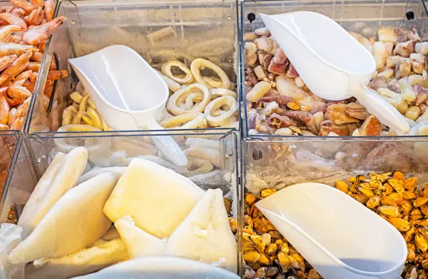 stock image sets of seafood by-products in the refrigerator in the supermarket by weight