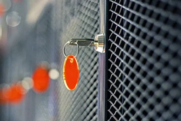 stock image key with key fob inserted into cabinets for storing personal belongings in a supermarket