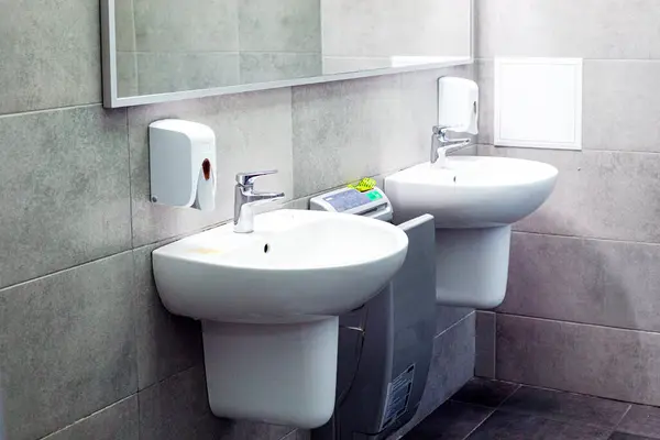 stock image modern bathroom interior with a sink and a faucet in the toilet room