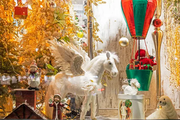 stock image winged horse with a Christmas tree and Santa Claus in a balloon. New Year and Christmas