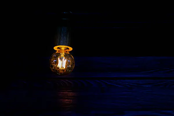 stock image glowing light bulb from an inverter or generator. energy crisis blackout