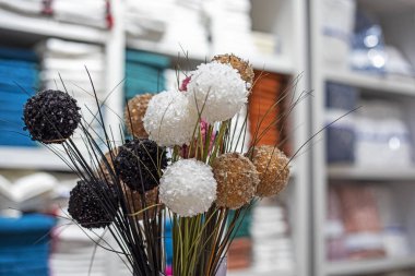 beautiful white brown and brown stylish balls in a vase in the interior clipart