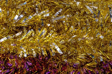 glittering festive abstract golden background made of thin paper. Festive mood clipart