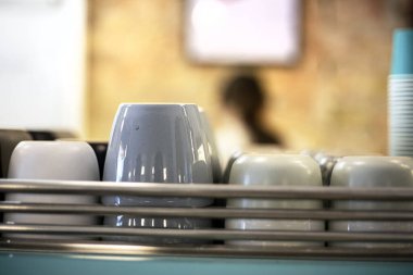 stylish ceramic cups in a cafe for coffee and tea
