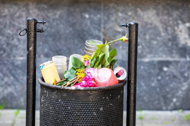 full trash can in the city outside. Environment