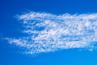 wavy clouds on a clear blue sky to rain