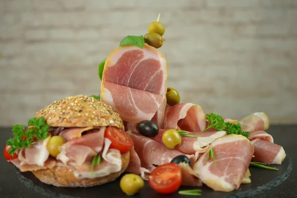 Iberian smoked ham sandwich with whole grain bun, Spanish meat composition