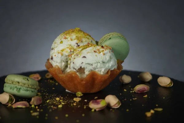 Refreshing green ice cream sparkled with chopped pistachio nuts, copy space