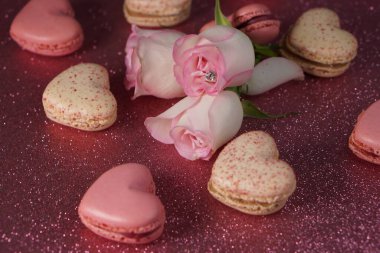Romantic composition for Valentines Day, engagement ring, heart-shaped macarons