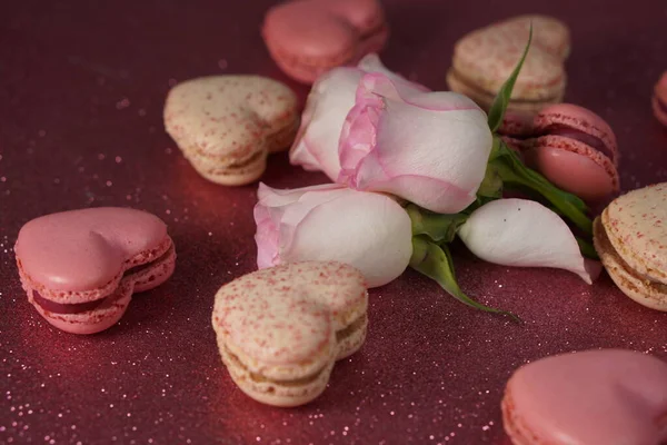 Romantic composition for Valentines Day, engagement ring, heart-shaped macarons