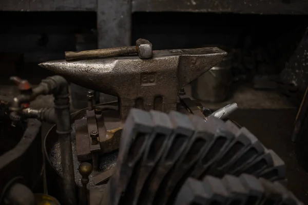 stock image blacksmith tools and metal blanks in privet forge. High quality photo