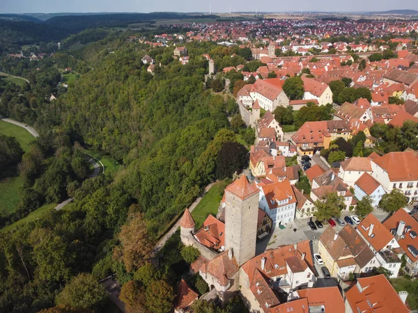 stock image Classic view of the medieval town of Rothenburg ob der Tauber with medieval wall and forest on a beautiful sunny day with blue sky and clouds in springtime, Bavaria, Germany. High quality photo