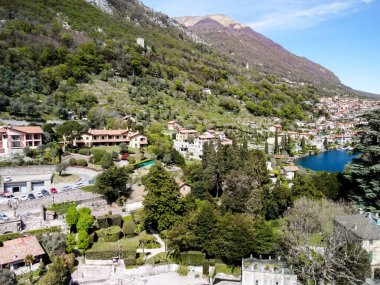 Aerial drone photo of iconic small port and fishing village Italy with turquoise and emerald clear waters. High quality photo. Nice Italian water and vibe. 