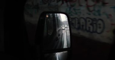 Driving through germany in a dark van watching rear view mirror. High quality 4k footage