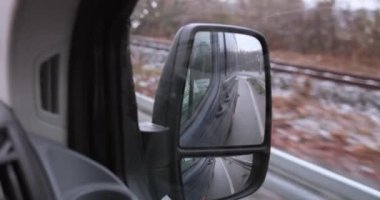Driving through germany in a dark van watching rear view mirror. High quality 4k footage