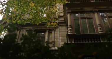 Looking at a old german stone mansion like building in residential area. High quality 4k footage