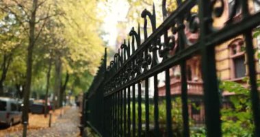 Going down residential city walk way during fall with golden autumn trees. High quality 4k footage