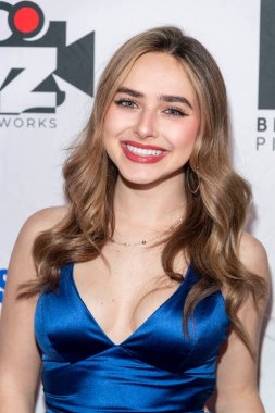 Actor Ashley Puzemis attends 