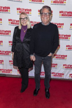 Actor Anson Williams with guest attends The Hollywood Museum Unveiling Of Film Legend Mary Pickford's Ball Gown at The Hollywood Museum, Los Angeles, CA March 4, 2023