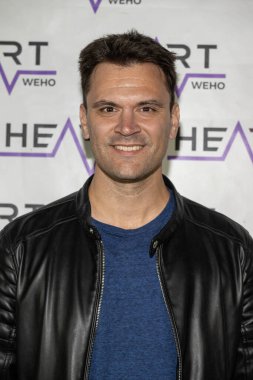 Actor Kash Hovey attends J. Michael Arnoldi Birthday Bash and Toy Drive featuring Performance of G Tom Mac at Heart WeHo Night club in West Hollywood, Los Angeles, CA December 9, 2023 clipart