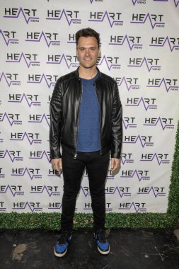 Actor Kash Hovey attends J. Michael Arnoldi Birthday Bash and Toy Drive featuring Performance of G Tom Mac at Heart WeHo Night club in West Hollywood, Los Angeles, CA December 9, 2023 clipart