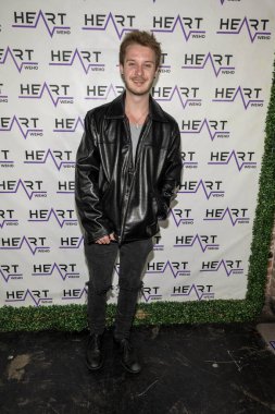 Actor Seth Bishop attends J. Michael Arnoldi Birthday Bash and Toy Drive featuring Performance of G Tom Mac at Heart WeHo Night club in West Hollywood, Los Angeles, CA December 9, 2023 clipart