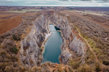 Aerial view of Velka Amerika,Big America,limestone quarry.Grand Canyon of Czech Republic.Labyrinth of caves,lake with crystal clear water.Popular tourist place,picturesque Czech nature,steep cliffs