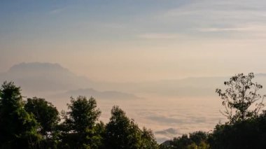 travel and people activity concept with twilight sky before sunrise with mountain and fog on foreground 