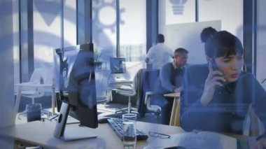 Animation of media icons over diverse business people in office. Global business and digital interface concept digitally generated video.