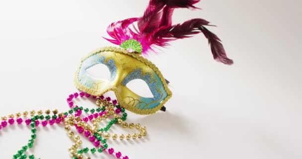 Video Masquerade Mask Pink Feathers Mardi Gras Beads White Background — Stock Video