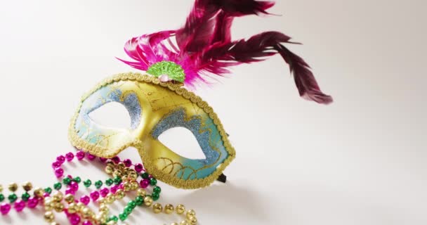 Video Masquerade Mask Pink Feathers Mardi Gras Beads White Background — Stock Video