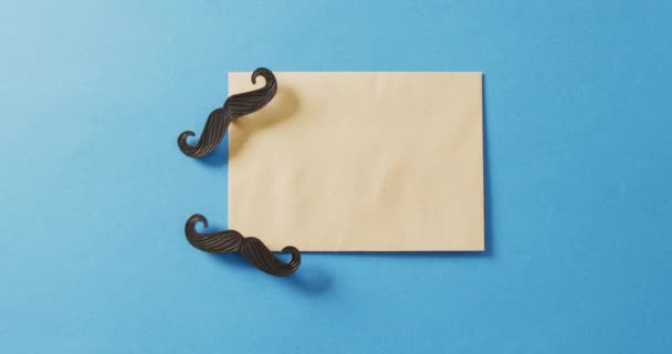 Video Two False Moustaches Yellow Envelope Blue Background Father Day — Stock Video