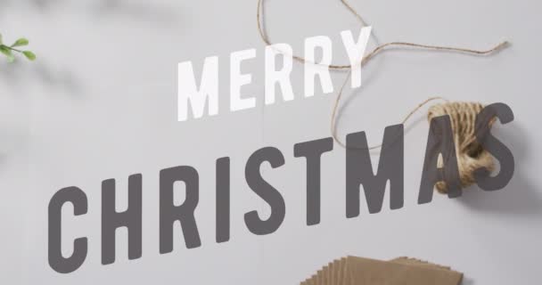 Анімація Різдвяного Вітального Тексту Над Різдвяними Прикрасами Різдво Святкування Святкування — стокове відео